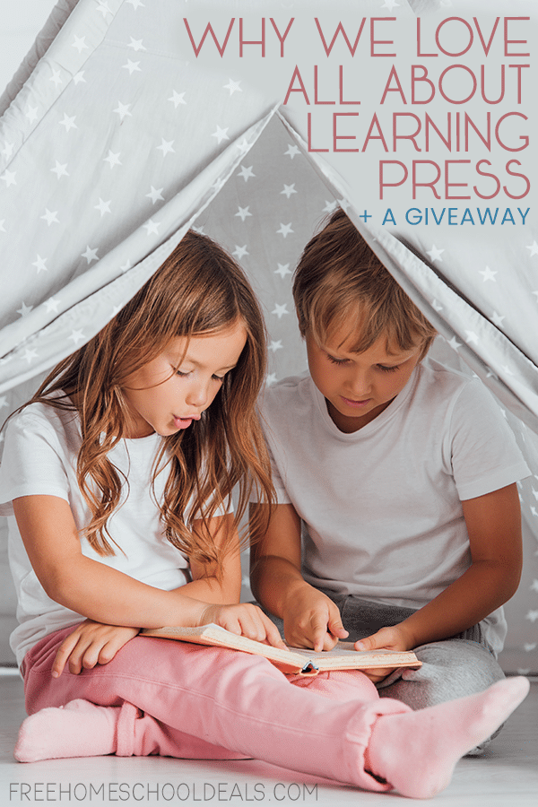 two children reading in a homemade tent- overlay "Why we Love All About Learning Press + Giveaway"