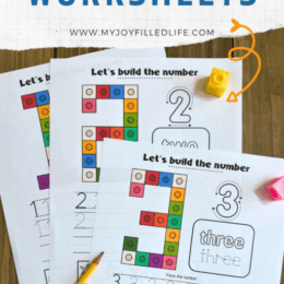 sample images of snap cubes numbeer worksheets with a pencil and spare snap cubes lying on top