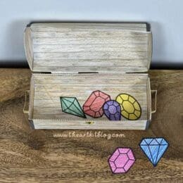 image of assembled 3D pirate treasure box with 6 colorful paper gems