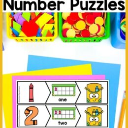 crayon number puzzles across the top with some baskets holding manipulatives and crayon-themed number strips