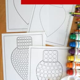 four printed Christmas light bult themed fine motor mats