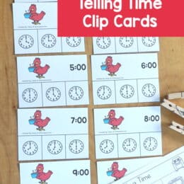 printed clip art cards of clock faces laid out on a table