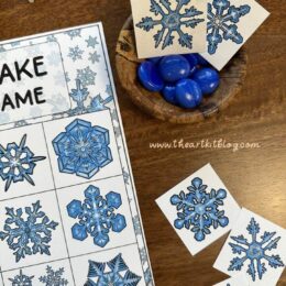 printed page with snowflakes and matching squares scattered around