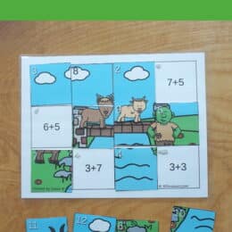 printed color puzzle pieces with addition facts beneath
