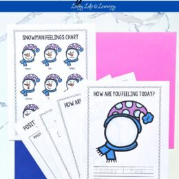 fanned out printed pages from the snowman feeling charts